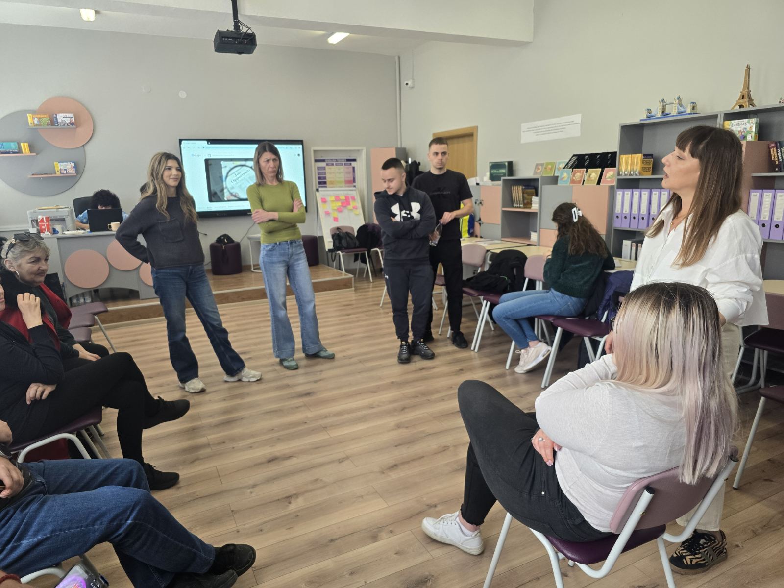 A facilitator leading a group discussion during the THRIVE youth worker training